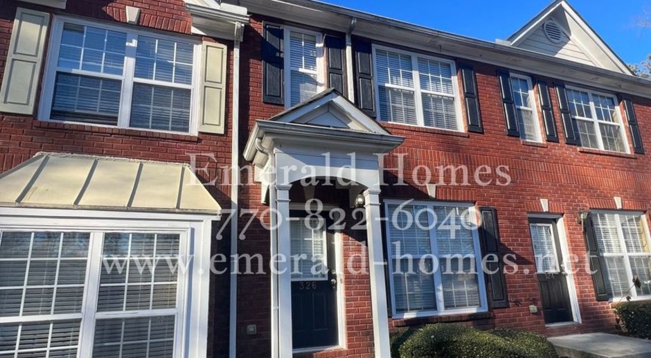 Beautiful brick front 2 bedroom 2.5 bath townhome in sought out Lawrenceville area!