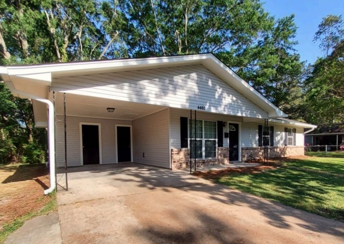Houses Near charming 3-bedroom home with an attached carport