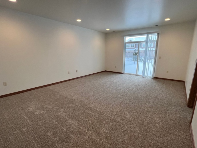 Spacious townhome! Family room, central heat & air, double garage and VIEWS!!! New carpet & paint!