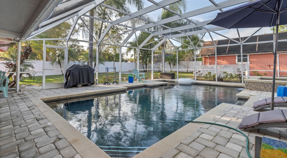 Luxurious FURNISHED 4BR/3BA Pool Home with Solar Panels & Outdoor Oasis!